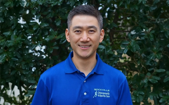 A professional photo of Dr. Yongmin Lee from Rockville Chiropractic & Sports Care